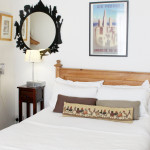 Hotel room with mirror on the wall