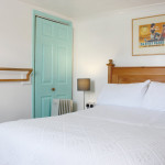 Room with white walls and blue doors